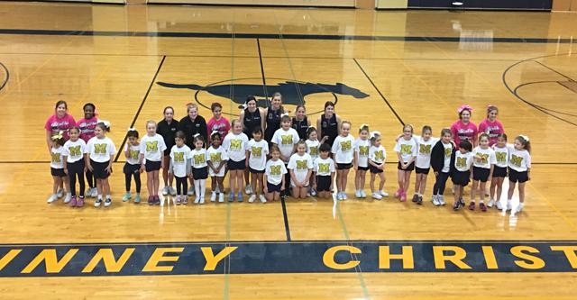 The Lil Stangs cheer squad pose for a picture after their cheer clinic past Saturday.
