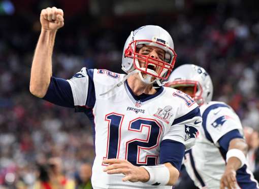 Tom Brady pumps his fist after a vital touchdown pass.