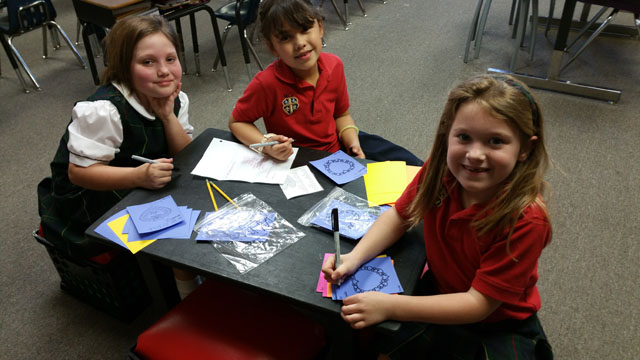 First grade students make Val-O-Grams to be sold during lunch. 
