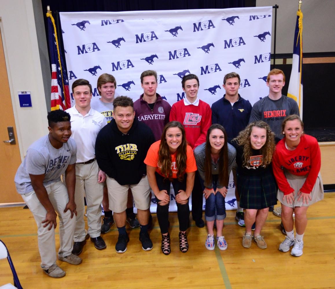 Signees took a group picture after signing their letter of intent. 