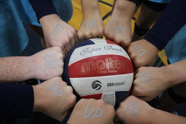 The JV girls wrote UP on their hands as a reminder to stay positive during their games.