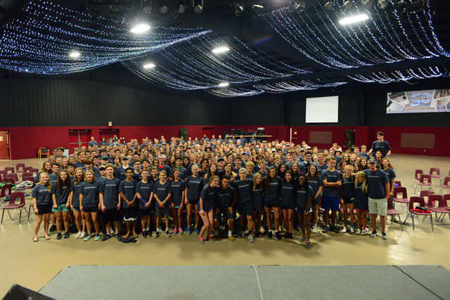 The entire upper school stands together for a group picture after retreat.