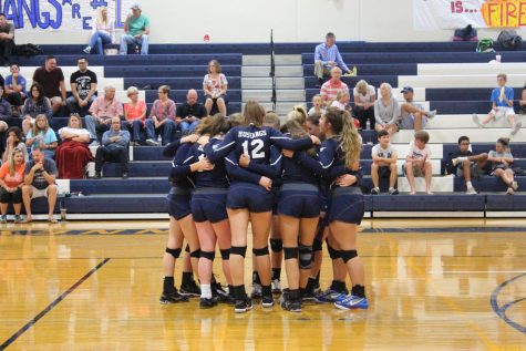 The JV girls gather for a pregame prayer and breakout into their first set against HSAA.