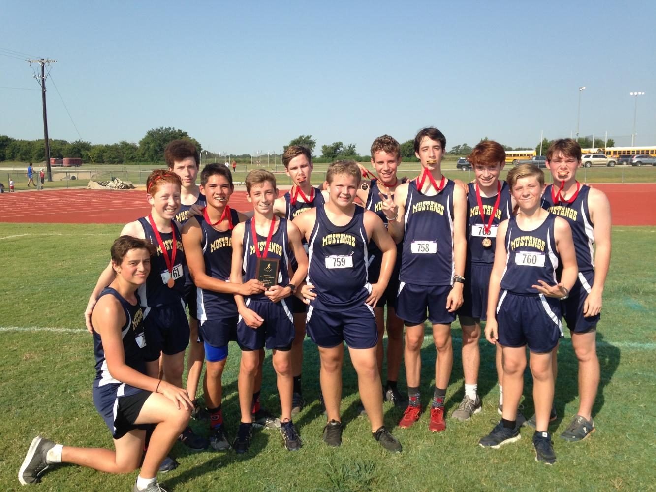 Boys Junior Varsity team shows off their first place trophy.