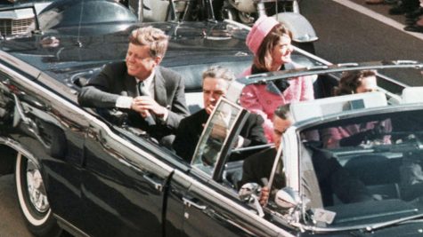 John Kennedy and his wife, Jackie Kennedy in the Dallas motorcade. This was taken moments before his death.