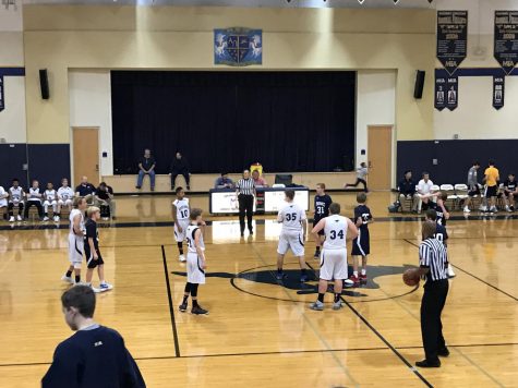 The middle School boys basketball team gets ready to tip off against Ovillia.