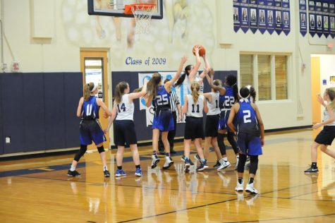 Eighth grader Karlene Shelton gets the rebound and is able to score a point for the Mustangs.