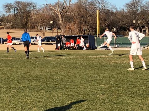 Senior guest player, Greg Newland shoots towards the Blazers goal.