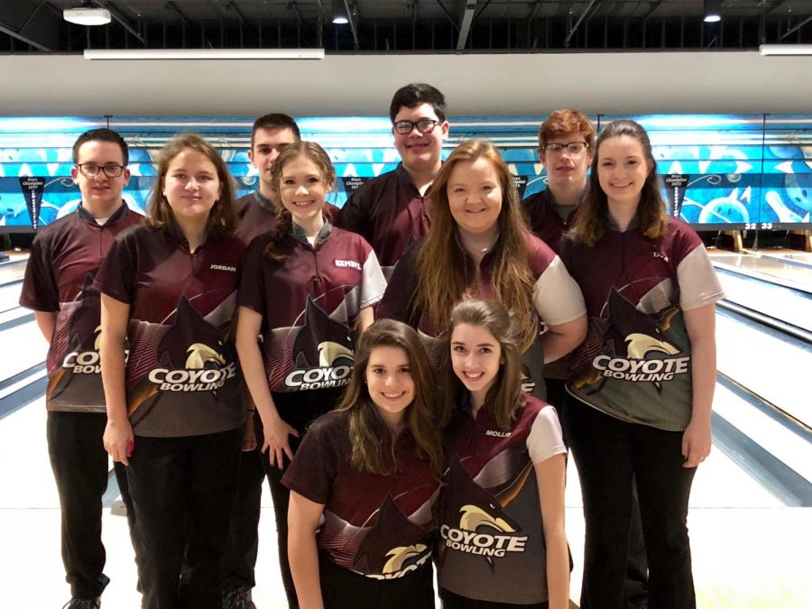 Sophomore Lydia Gilbert takes a picture with her bowling team after finishing third place at their tournament 