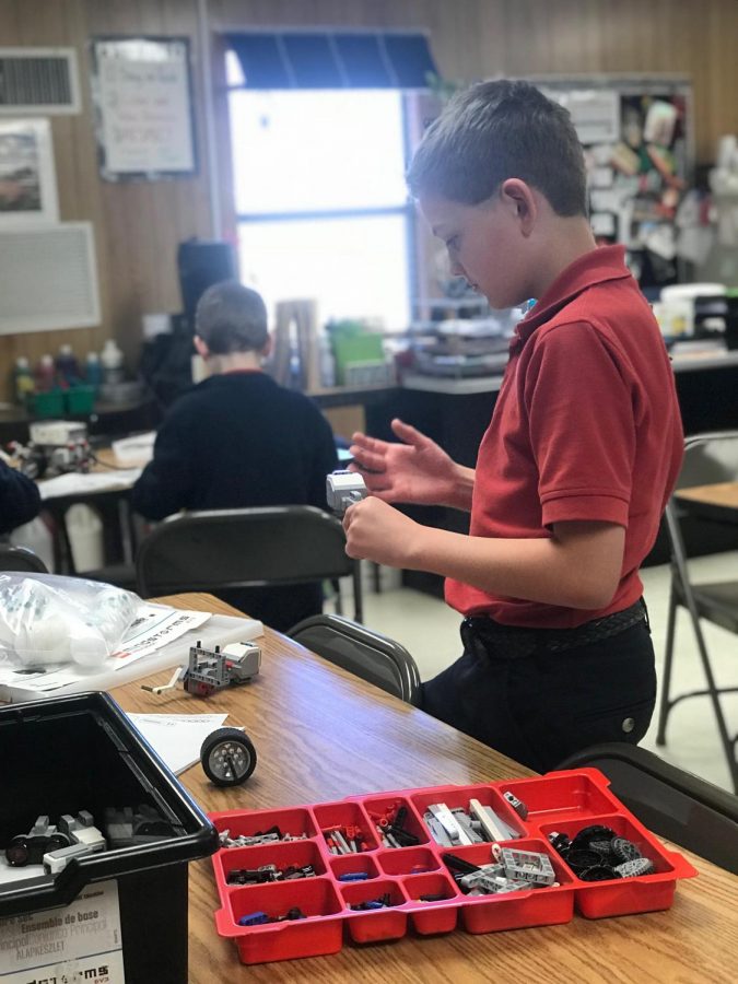 Fourth grader Kolton Kuykendall works on a project with legos. 