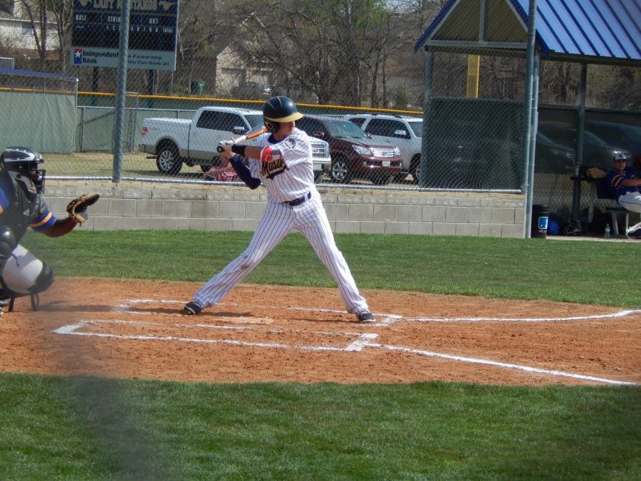 Sophomore Stone Knowles goes up to bat and hits a double.