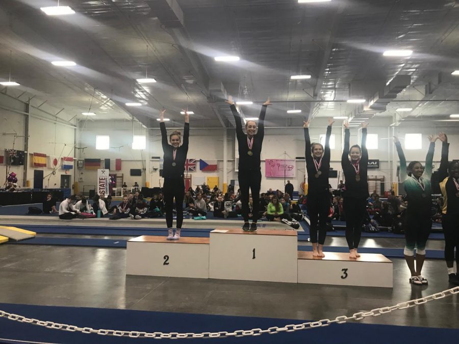 Sophomore Hannah Grubbs places second place in the balance beam competition