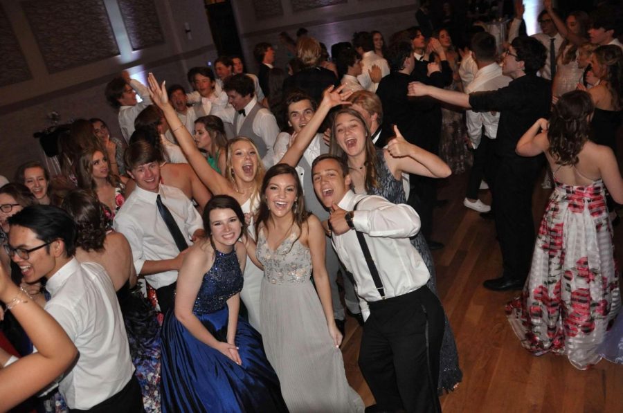 A group of Seniors get together for a fun picture at their last Prom.