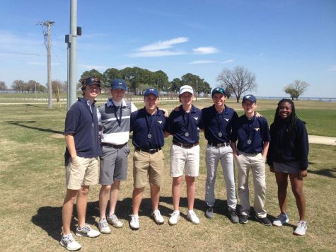 This years Varsity Golf team poses for a picture after their first tournament of the season.