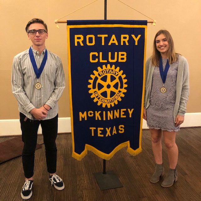 Seniors Syler Gabel and Elyse Mead pose by the Rotary Clubs banner after being awarded the honor of students  of the month.