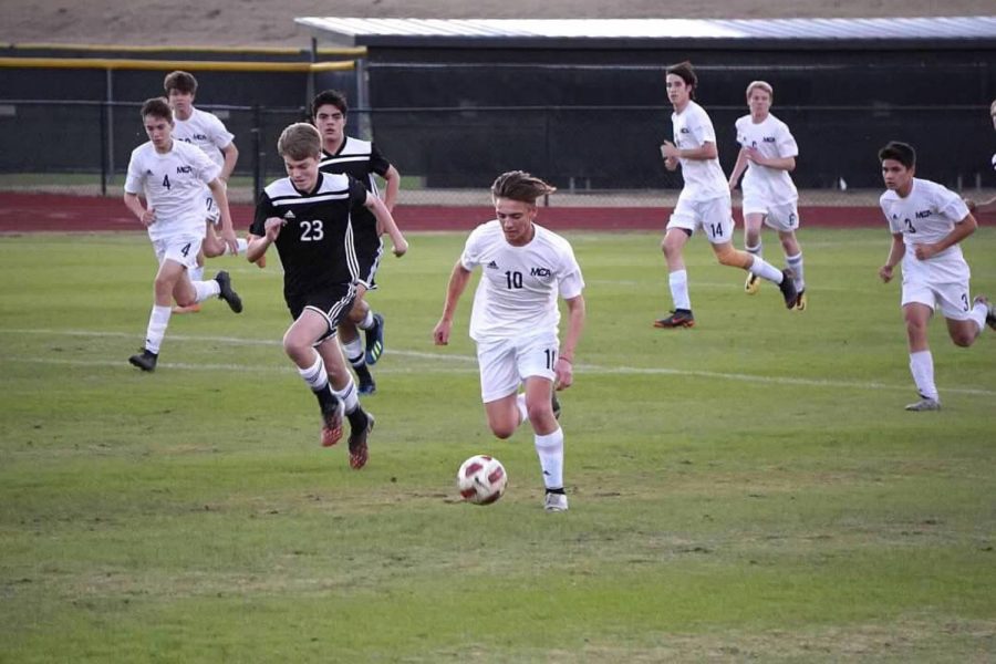 Senior Syler Gabel picks the ball off from a bad pass from the opposing team. Most games with the Mustangs are a constant back and forth struggle, and good midfielders like Syler prevent this from happening.