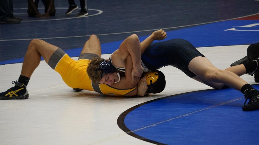 Captain Court Doyle pins his opponent from St. Marks. 