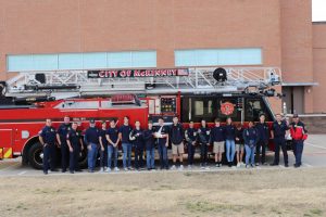 The Teen CERT class gathers in front of a visiting fire truck for a picture. Firemen and paramedics from Station 2 visited MCA to teach the Teen CERT class emergency first aid and how to properly care for the injured.