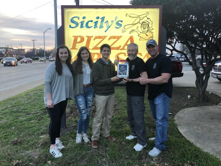 During the fundraiser at Sicilys last night, senior NHS officers Emma Lowes, Juliana Roller, and Josh Wong presented Officer Hamiltons father with the money the MCA students raised.