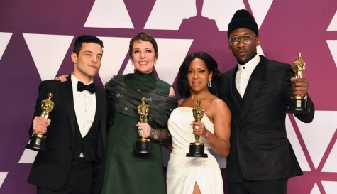 Award winners pose for a picture with their trophies.