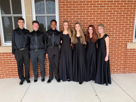 MCA ensemble members smile for a picture after their competition.