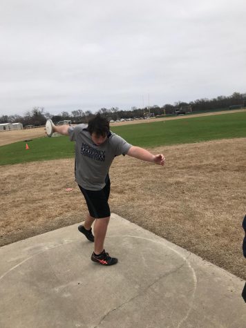 Senior Josh Pawlish practices throwing discus while at track practice.