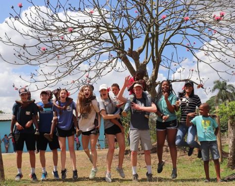 The students jump for joy with the kids in Dominican.