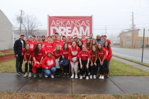 The Arkansas Mission team posed for picture in front of the Dream Center sign after helping them for five days. 