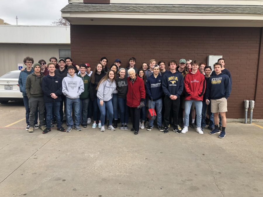 The group poses for a picture on Thursday at Mission Arlington with founder Tillie Burgin .