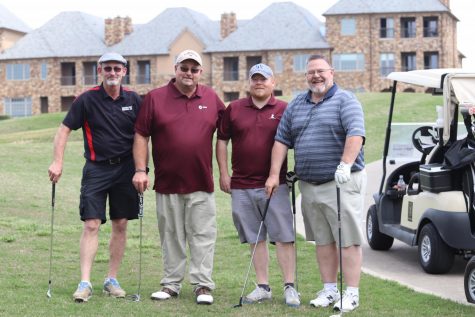 Steve Powell, Scott Powell, and Chris Estep and MCA Headmaster Bob Lovelady stop golfing to pose for a picture.