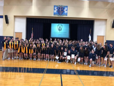 All ot the NHS members, new and old, get together for a big group picture after the induction ceremony.