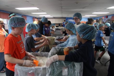 4th and 5th graders worked together to assemble food packages.