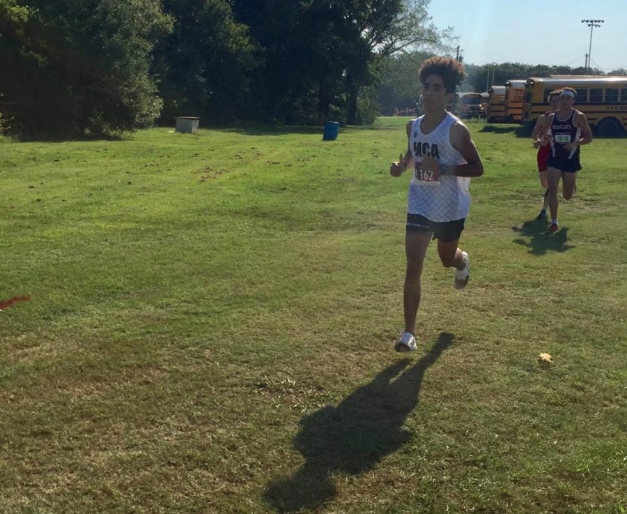 Junior, Maliq Brock runs early Saturday morning in the meet.