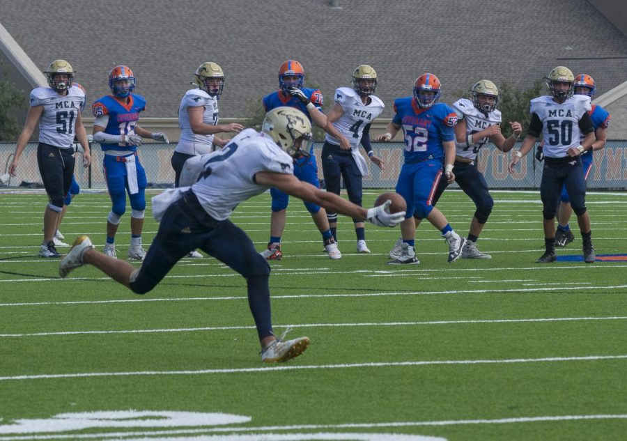 Senior Ford Dossey makes one-handed snag.