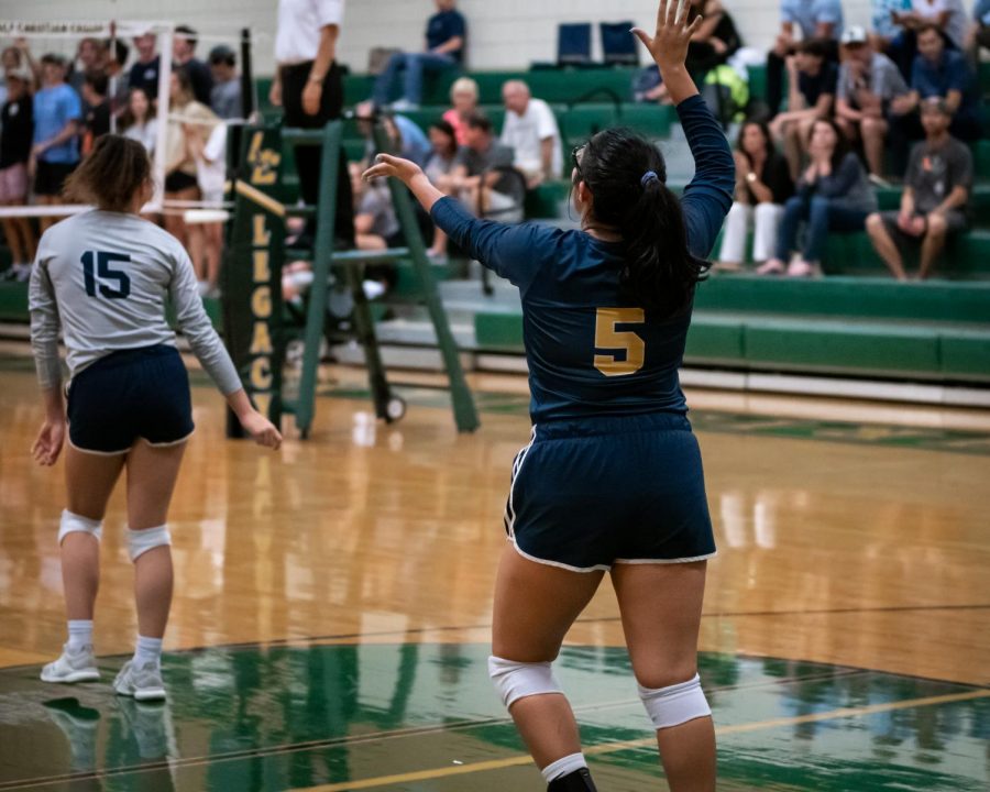 Daniela Morales serving the ball to the opposing team, Legacy Christian.