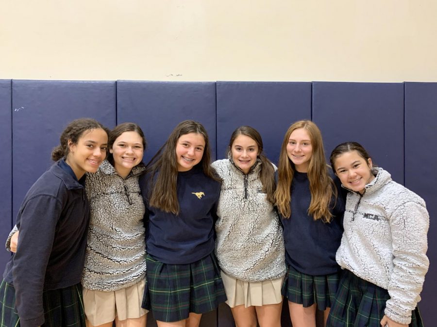 Middle School Girls, Sky Miller, Brooklyn Claudio, Lauren Etheredge, Ava Thompson, Tatum Goshgarian pose for a picture in their MCA sherpas and sweatshirts.