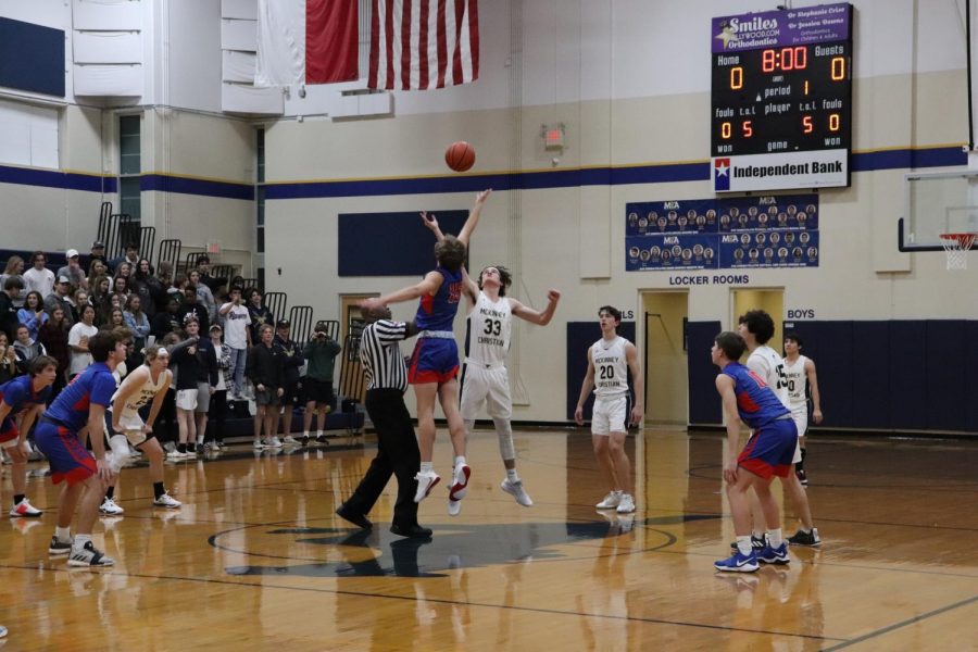 Senior Dustin Rogers goes up to get control of the ball at tip off. 