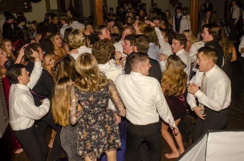 The senior class enjoys one last dance together at their last Winter Formal by dancing to