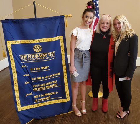 Seniors Sydney Wible and Meg Boone pose for a picture with Dr. Jane DeBord at the rotary club.