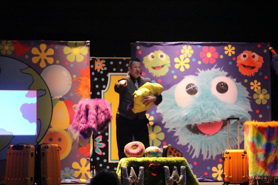 Denise Lee puts on his show with one of his puppets.