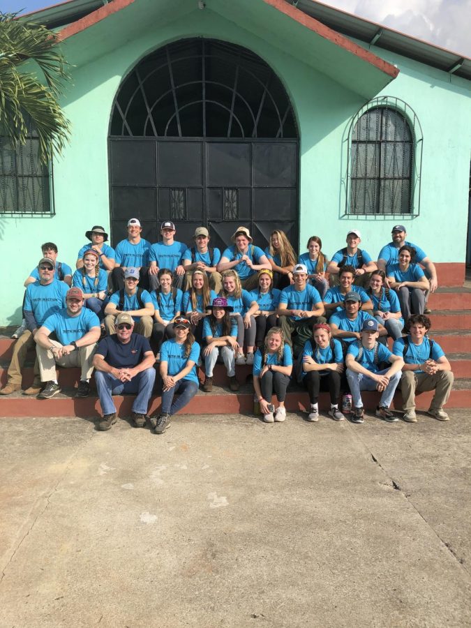 The mission team posed for a picture in front of the church they were working at. 