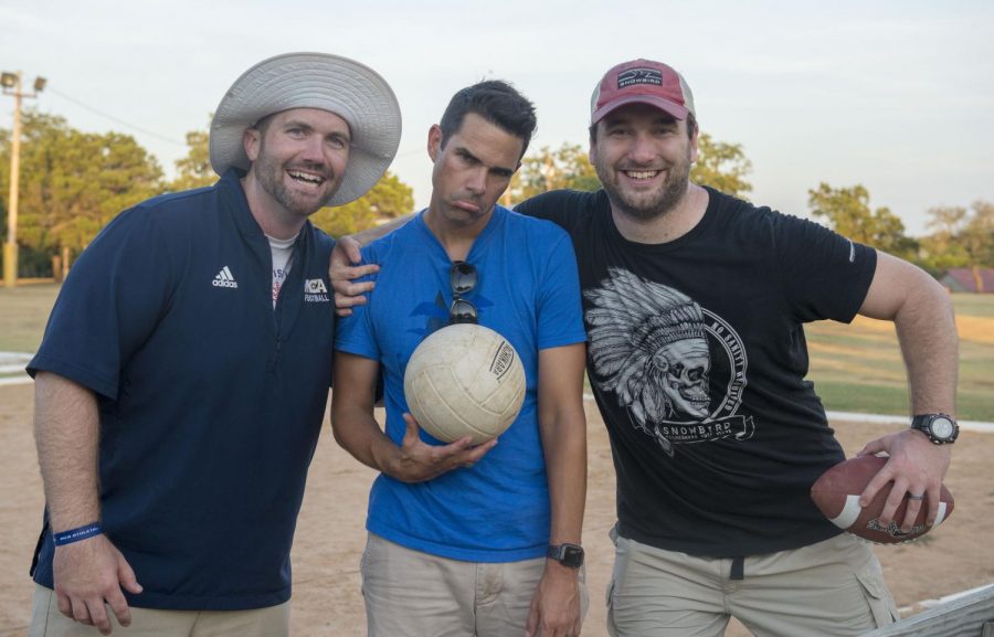 Upper School Spiritual Life Pastor Trey Postelle, Counselor John Woodruff, and football Coach Chance Gray pose for a picture after a fun pick-up game of sand volleyball at Upper School retreat. 