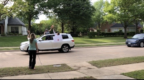 Mrs. Kuykendall waving at her students at her birthday parade.