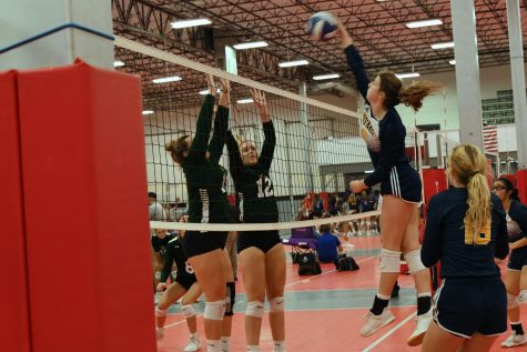 Senior Ava Grace Haggard goes up for the kill.