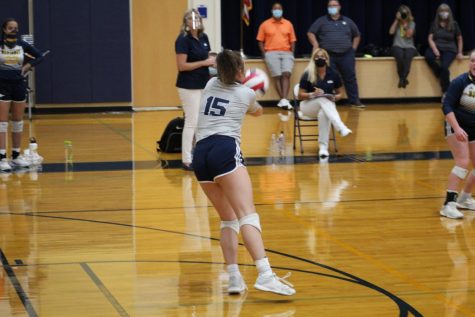 Senior Micah McDowell taking the first pass off of the opponents serve.