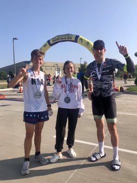 Alessia Catullo, Nick Catullo and Rhett McKeller smile, displaying their first place medals.