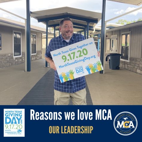 Principal Chris Hydock advertises North Texas Giving Day with a sign.