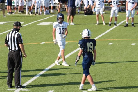 Eighth grade captain Judd Witte, meets the captain of Providence at the coin flip.