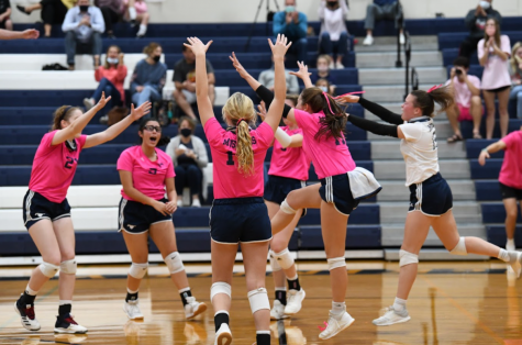 Lady Mustangs cheer after blocking Brookhill.