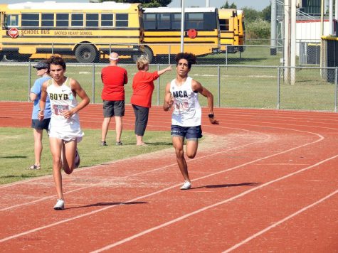 Senior Maliq Brock running during his race.